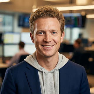 Ryan Brooks, listed as Lead Trading Analyst at Clear Meritowage, in a profile photo